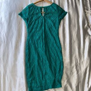 Mermaid teal colored dress.